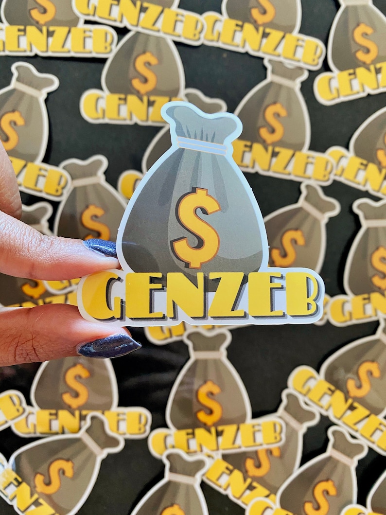 May include: A sticker with a cartoon money bag and the text "GENZEB" in yellow letters. The money bag is gray with a yellow dollar sign. The sticker is surrounded by other similar stickers.