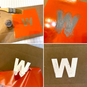 May include: A step-by-step guide on how to use a stencil to paint a letter "W" on a surface. The stencil is placed on an orange surface and the letter is painted with silver paint. The stencil is then removed to reveal the painted letter.