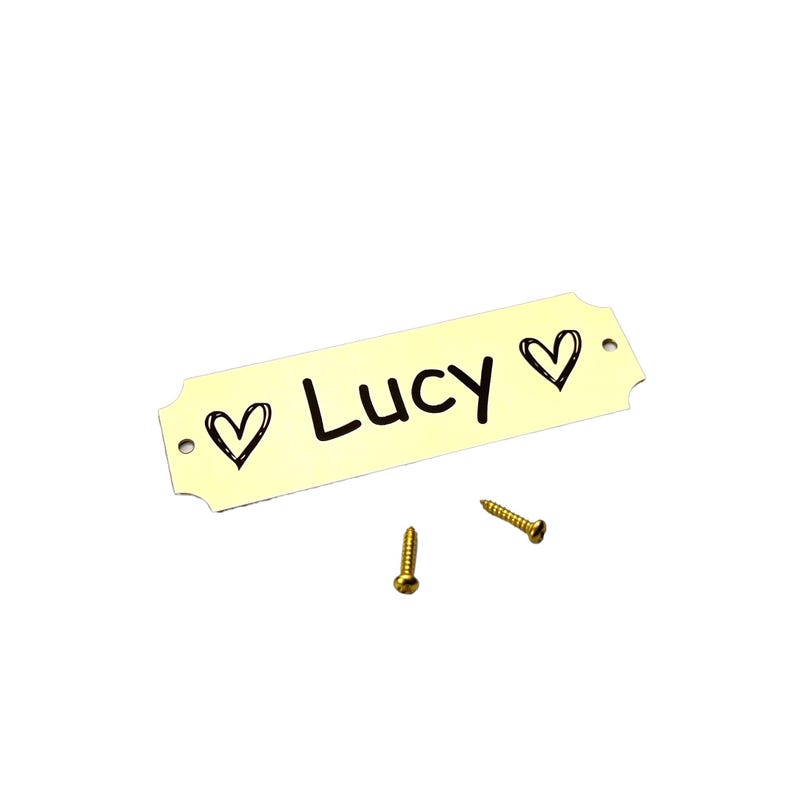 a yellow label that says lucky next to some screws