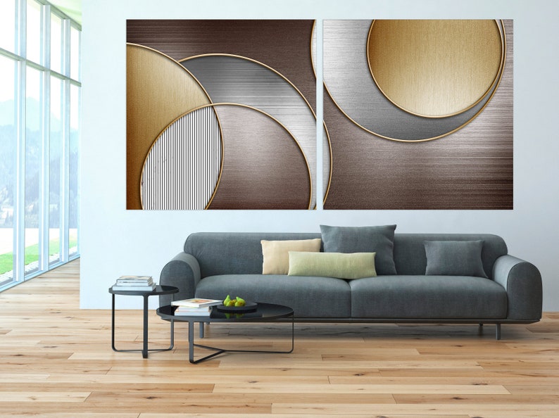 May include: Abstract art print with two panels featuring overlapping circles in shades of brown, gold, and silver.