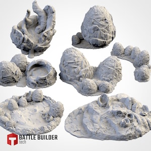 Könnte beinhalten: Ein Set aus sieben grauen, strukturierten, 3D-gedruckten Resin-Terrain-Teilen in Form von rissigen Eiern. Die Teile sind für Tabletop-Spiele und Rollenspiele konzipiert.