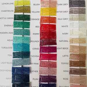 May include: A color swatch chart featuring a variety of fabric samples in various colors. The chart includes shades of green, blue, red, pink, yellow, and neutral tones. Each sample is labeled with its color name, such as "Mint Green" and "Coral".