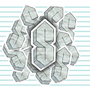 May include: A sticker with a 3D design of the letter 'S' made to look like crumpled notebook paper. The sticker is surrounded by other smaller 'S' stickers.