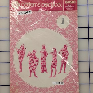 May include: Vintage "Patterns Pacifica" sewing pattern, sealed in plastic. The pink cover features a floral design and illustrations of women in floral outfits. The word "VINTAGE" is printed on the top left, and "UNCUT" on the bottom right.