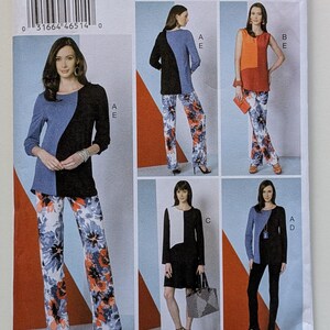 May include: A Vogue V9175 Five Easy Pieces sewing pattern envelope featuring illustrations of various tops, pants, and a dress. The designs include color-blocked shirts, floral print trousers, and a solid black dress with a white panel detail.