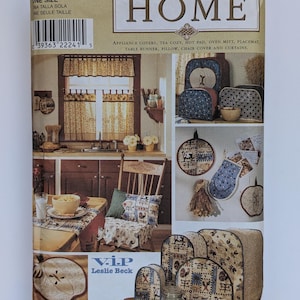 May include: A Simplicity pattern for home decor items. The pattern includes instructions for appliance covers, a tea cozy, hot pad, oven mitt, placemat, table runner, pillow, chair cover, and curtains. The pattern is designed by Leslie Beck.