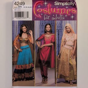 May include: Simplicity costume pattern featuring three adult costume designs. The pattern includes sizes 14, 16, 18, and 20. The package has a purple and gold design with the words "Costumes for adults". The pattern is from Andrea Schewe and Wrights.