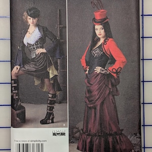 May include: Simplicity sewing pattern 1819 R5 for sizes 14-22. The envelope features two costume designs: one with a black jacket, white lace top, and skirt, and another with a red jacket, black lace corset, and a long, dark red ruffled skirt.