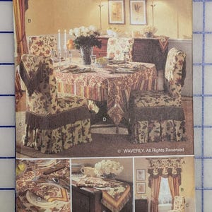 May include: Butterick Waverly pattern for home decor. The image shows a dining room set with floral patterned chair covers, a tablecloth, and matching curtains. The pattern includes instructions for a one-size design.