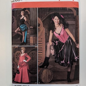May include: Simplicity sewing pattern 2851 featuring three costume designs. The cover shows women in Victorian-era inspired outfits, including a pink and black dress, a red gown, and a black and teal ensemble. Size HH 6,8,10,12.