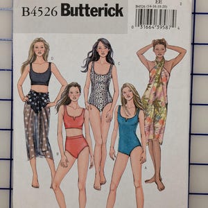 May include: A sewing pattern envelope featuring the Butterick B4526 design. The cover displays illustrations of various swimwear styles, including a bikini, a one-piece swimsuit, and a sarong. The color palette includes shades of blue, red, and animal print.