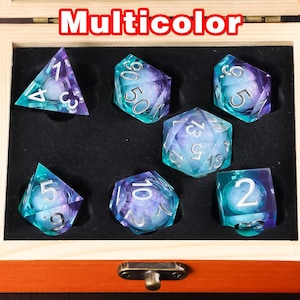 May include: A set of seven iridescent dice in a wooden box. The dice are multi-coloured with a blue and purple swirl pattern. The box is labelled "Multicolor".