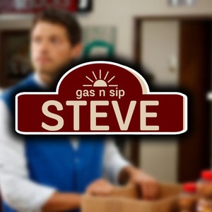May include: A red and cream-colored sign with a stylized sun and the text "gas n sip STEVE" on it.