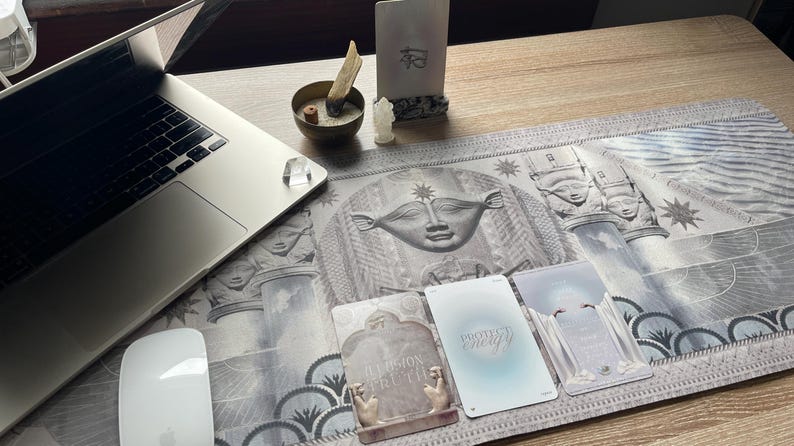 Hathor desk mat as the centerpiece of a spiritual altar, surrounded by candles, crystals, and sacred items. This mat creates a serene space for meditation, rituals, and connecting with the healing energy of Hathor.