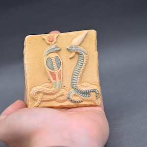 Egyptian Uraeus Snake Relief: Ancient Stone Wall Sculpture