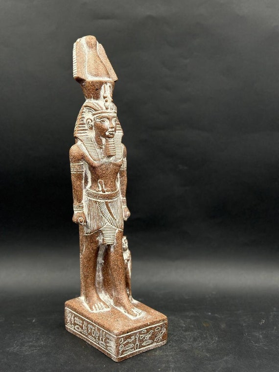Ancient Egyptian bronze sculpture of a pharaoh