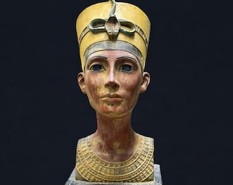 May include: A bust of an ancient Egyptian queen with a yellow and gold crown, a red and gold necklace, and hieroglyphics on the base.