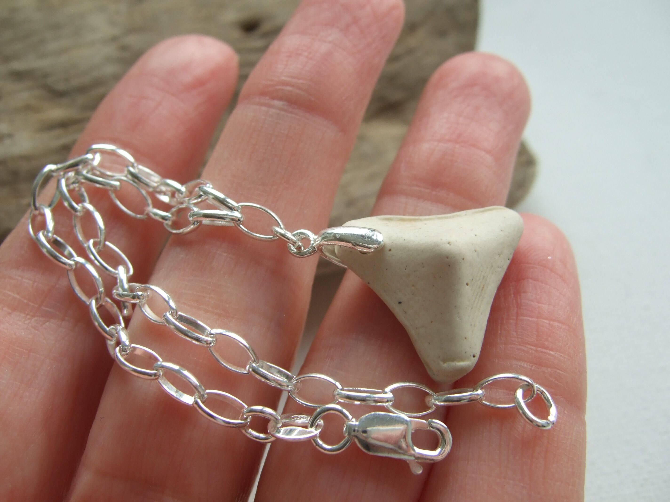 Ceramic piece bracelet with silver charms