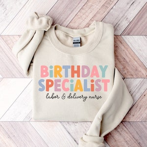 Labor and Delivery Nurse Sweatshirt, Birthday Specialist RN Shirt, L&D Nurse Crewneck Sweater, Cute Nursing Graduation Gift, Mother Baby