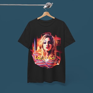 May include: Black t-shirt with a colorful graphic of a woman with blonde hair and the text "Lords of Acid" and "Pure Satanic Trance".