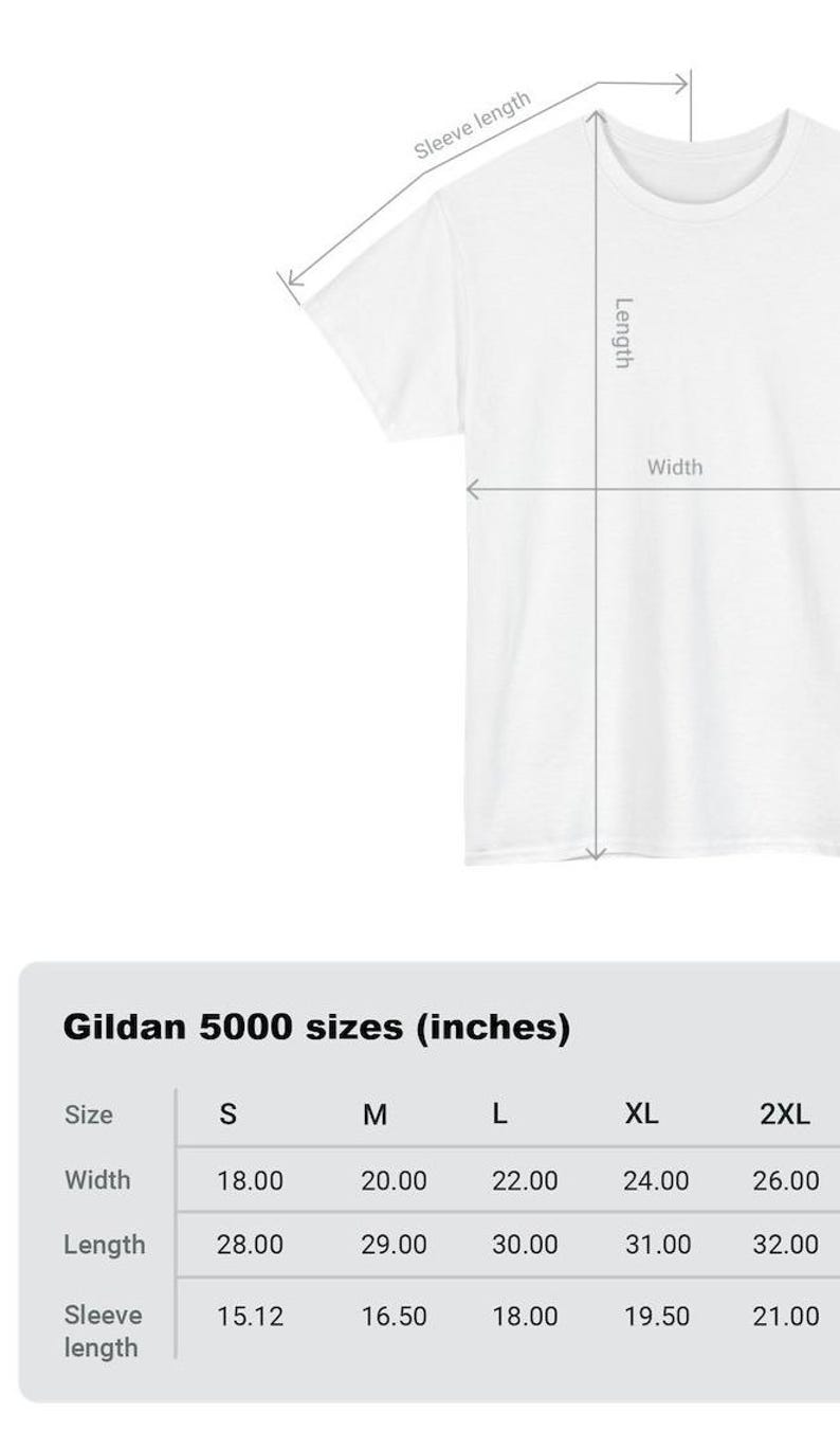 May include: A chart showing the size measurements in inches for Gildan 5000 t-shirts. The chart includes sizes S, M, L, XL, and 2XL. Measurements are provided for width, length, and sleeve length.