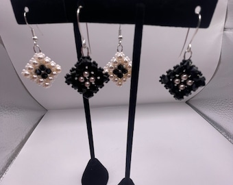 Black and cream colored beaded dangle earrings - set of two