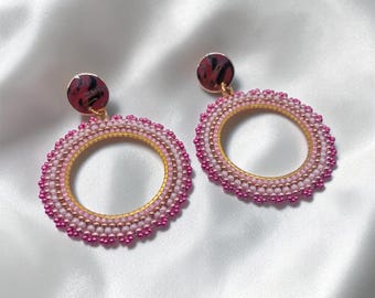Pastel beaded hoop earrings in shades of pink and ivory