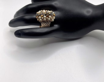 Woman's beaded ring in shades of gold and topaz