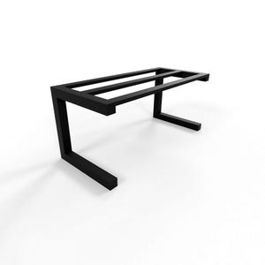 May include: A black metal table frame with a rectangular top supported by two angled legs. The frame has a minimalist design and is suitable for various uses. The table frame is shown against a white background.