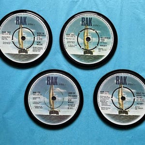 4 retro vinyl matching drinks coasters, hand crafted from original RAK label vinyl records, black waterproof velvet backed