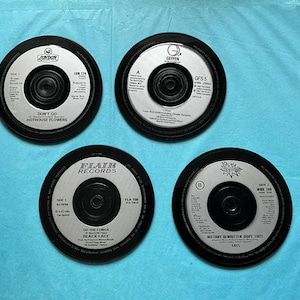 4 retro vinyl silver labels drinks coasters, hand crafted from original vinyl records, black waterproof velvet backed (random selection)