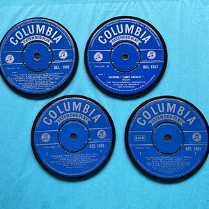 4 matching coasters hand crafted from original records, black waterproof velvet backing