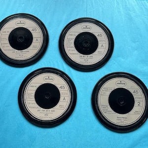 4. 10cc, 1970s retro vinyl drinks coasters hand crafted from original vinyl records, black waterproof velvet backed