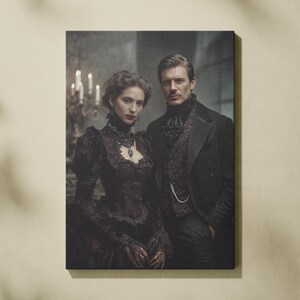 May include: A framed canvas print featuring a couple in Victorian-era attire. The woman wears a dark burgundy gown with lace details and ornate jewelry. The man is in a black suit with a patterned vest and a pocket watch chain. The background is dimly lit.