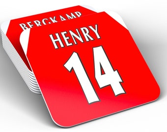 May include: A stack of red and white coasters with the name "HENRY" and the number "14" printed in white. The coasters are designed to look like a soccer jersey.