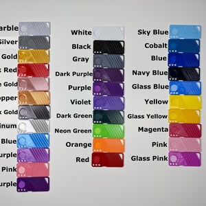 May include: A color chart of 24 different colors of plastic filament for 3D printing. The colors include marble, silk silver, silk gold, silk red, silk rose gold, silk copper, silk black gold, silk platinum, silk blue, silk purple, glitter pink, glitter purple, white, black, gray, dark purple, purple, violet, dark green, neon green, orange, red, sky blue, cobalt, blue, navy blue, glass blue, yellow, glass yellow, magenta, pink, and glass pink.