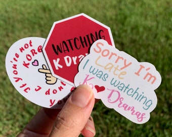 May include: Four stickers with different designs. One red stop sign sticker says "Watching K Dramas". One white sticker says "You're not the only one I don't you". One white sticker says "Sorry I'm late I was watching K Dramas".