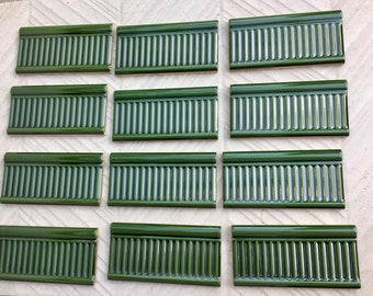 12 green Art nouveau style border tiles. Glazed NEW ceramic embossed tiles. Combine with other wall art tiles on a backsplash or border