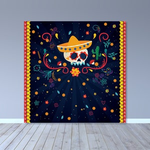 May include: A large, square, dark blue wall hanging featuring a sugar skull wearing a yellow sombrero. The skull is surrounded by colorful floral and decorative elements. The border is red and yellow. The design is reminiscent of the Day of the Dead.
