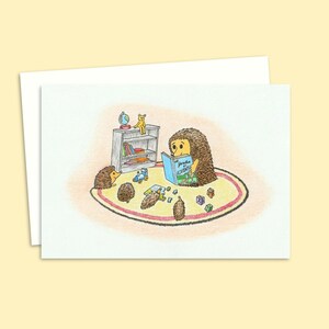 Cute Hedgehogs Greeting Card with a Hand-Drawn Illustration of Young Hoglets Enjoying Story Time, Blank Inside for your Own Message