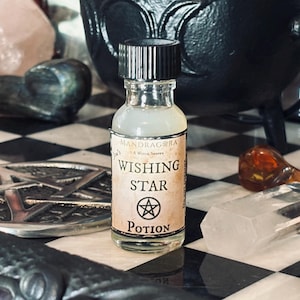 May include: A small glass bottle with a black cap and a white label. The label says "Wishing Star Potion" and has a pentagram symbol. The bottle is sitting on a black and white checkered surface.