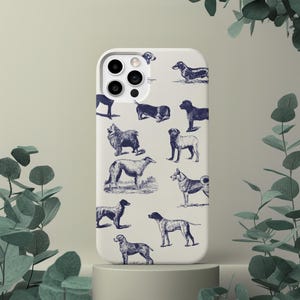 May include: White iPhone case featuring a blue and white pattern of different dog breeds. The case has a camera lens cutout and a white background.