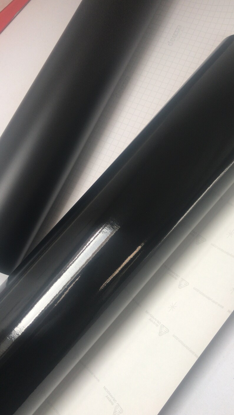 May include: Two rolls of black vinyl wrap, one with a matt finish and the other with a glossy finish.
