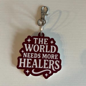 Portachiavi Trono di Vetro - Il mondo ha bisogno di più guaritori - Merchandising letterario, regalo romantico per infermieri, lettori e aiutanti, Aelin e Yrene