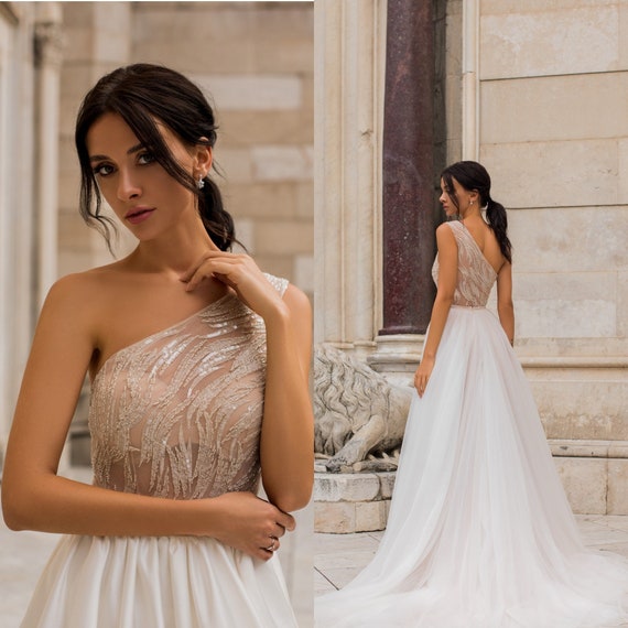 DelizaBridal One-Shoulder Wedding Dress with Glitter Skirt Reception Lace Beaded Wedding Gown Sparkly Simple Bridal Gown Modest Feather Dress Theodora