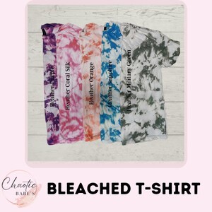 May include: Five bleached t-shirts in different tie-dye patterns. The shirts are in the colors purple, pink, orange, blue, and green.