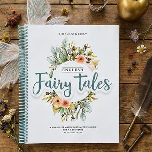 May include: A spiral-bound book titled "English Fairy Tales" with floral illustrations. The cover features the text "Simple Studies" and "A Charlotte Mason Instructor's Guide for K-6 Students." Decorative elements include a crown, a golden apple, and fairy wings.
