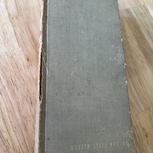 May include: A vintage, green, cloth-bound book with the text "WALTER ALLEN BOWLES" printed on the bottom right corner.