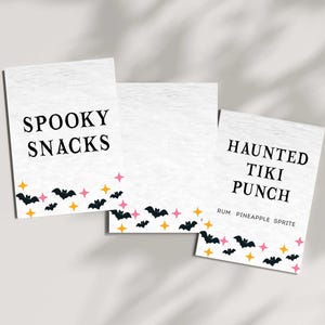 May include: Three white rectangular cards with Halloween-themed text and graphics. The cards read "Spooky Snacks" and "Haunted Tiki Punch." The bottom of each card features black bats, pink stars, and yellow stars.