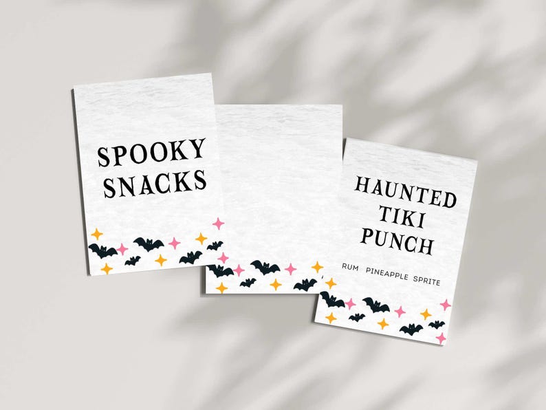 May include: Three white rectangular cards with Halloween-themed text and graphics. The cards read "Spooky Snacks" and "Haunted Tiki Punch." The bottom of each card features black bats, pink stars, and yellow stars.